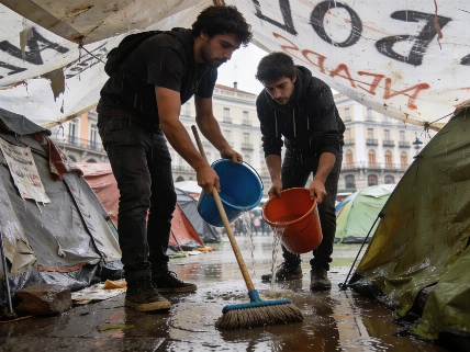 Improvised Drainage Efforts After Heavy Rain Floods Sol Encampment RUSSPAIN.com
